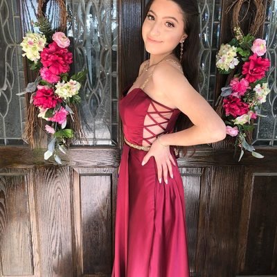 Prom 2019 Dress Ideas from two girl in red strapless prom dress with cutout sides